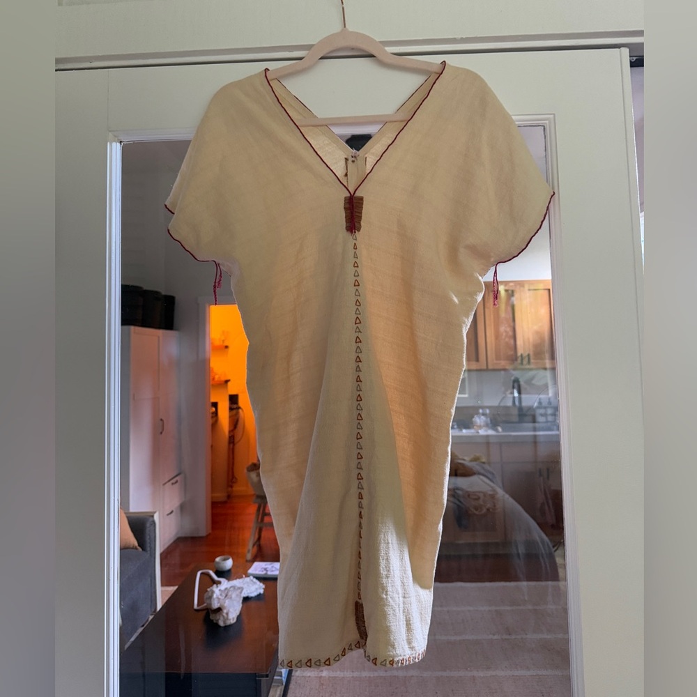 Elegant Cream Dress with Red Accents